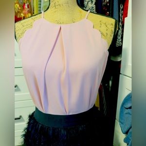 Sleeveless blouse with scallop detail